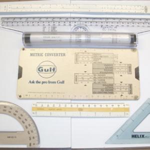 A variety of slide rules are available for demonstration.