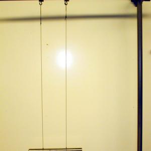 Suspend the bar by the bifilar strings so that it is horizontal and the strings are hanging straight down and parallel. 
