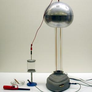 Volta's Hailstorm may be used to precipitate smoke particles.  Fill the apparatus with smoke and connect the two plates of the apparatus, one to Van de Graaff ball and one to the Van de Graaff base.  When the Van de Graaff is turned on the smoke is attracted to one of the plates and precipitates out of the atmosphere. You can make a larger version of this by using a 2 L. soda bottle.  Insert electrodes into each end, fill with smoke, and turn on the VDG.  