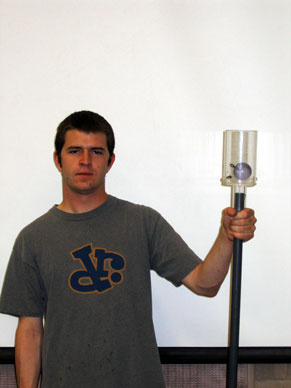 man showing Plexiglas Cup on Pole Apparatus