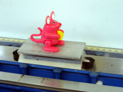 mouse figure on an air track