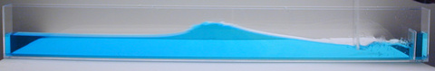 Narrow long wave tank with paddle