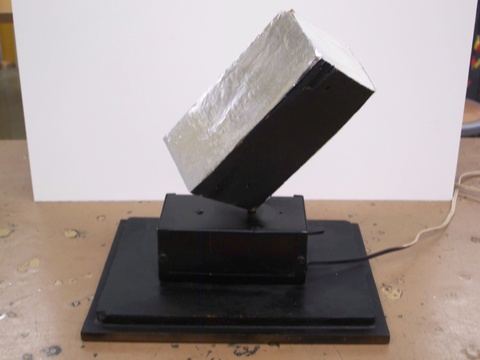  Rotating block with white and black surfaces