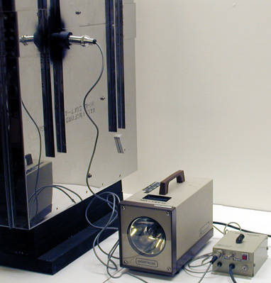 Laser Demo with Ping-Pong Balls, Strobe Light with Pickup Processor Box and Photocell Counter, Ring stand, and Air Hose.