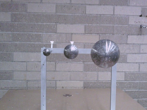 Protoplanet Demo, three metal balls on a rack